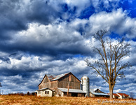 Farm-with-dramatic-clouds