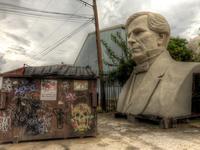 President-bust-and-dumpster-