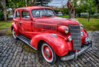 Old-red-car-under-the-rain-autumn