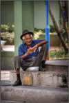 Old-man-on-street-corner-in-the-city-of-moron-cuba